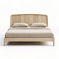 Wooden bed frame with upholstered headboard and cushions in beige color